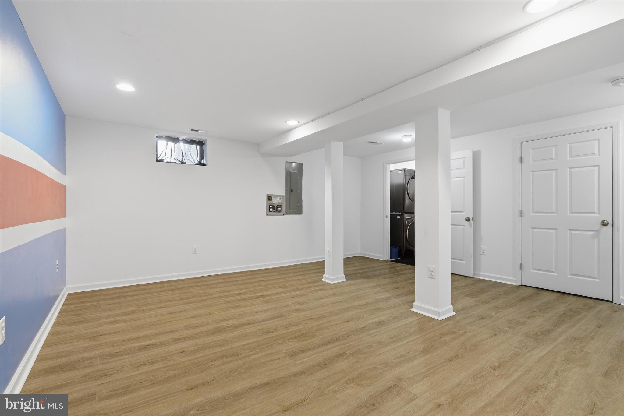 7428 Hawkins Drive Hanover, MD 21076 - Photo 22 of 44 a view of an empty room with wooden floor