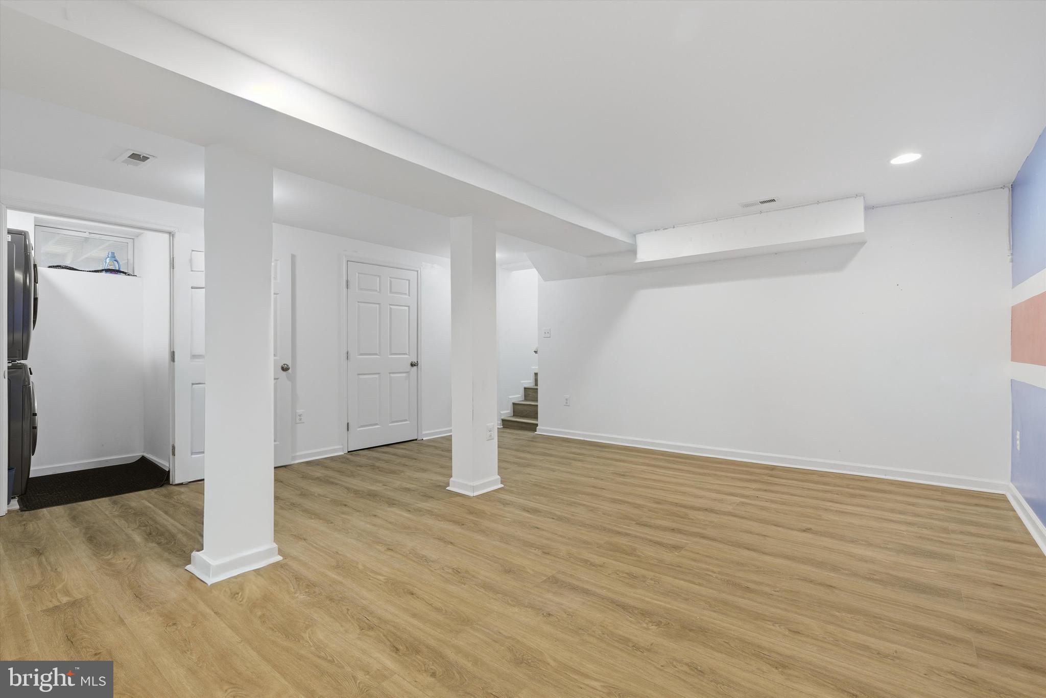 7428 Hawkins Drive Hanover, MD 21076 - Photo 23 of 44 a view of an empty room with wooden floor