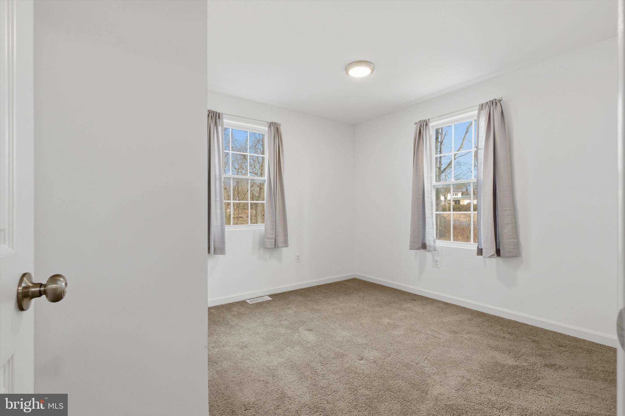 7428 Hawkins Drive Hanover, MD 21076 - Photo 30 of 44 an empty room with windows