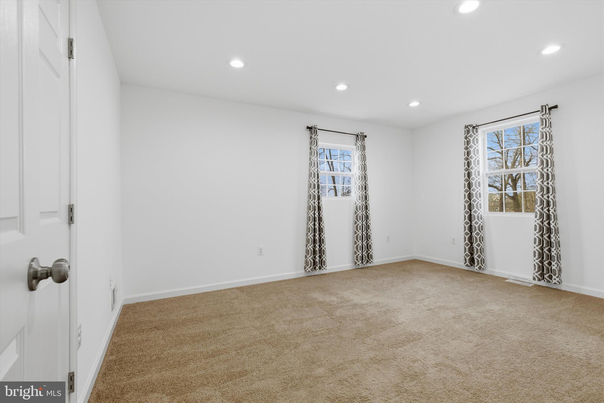 7428 Hawkins Drive Hanover, MD 21076 - Photo 32 of 44 wooden floor in an empty room with a window