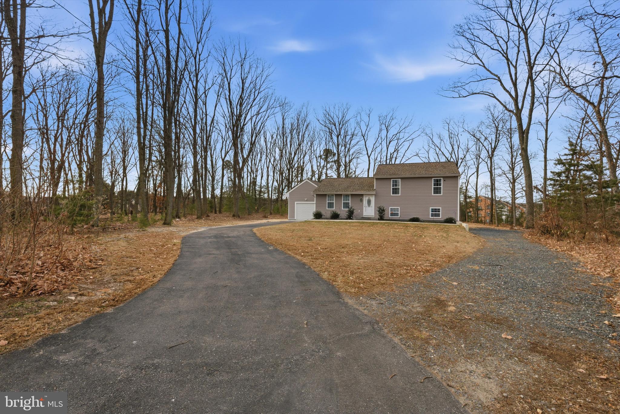 7428 Hawkins Drive Hanover, MD 21076 - Photo 4 of 44 a house with trees in front of it