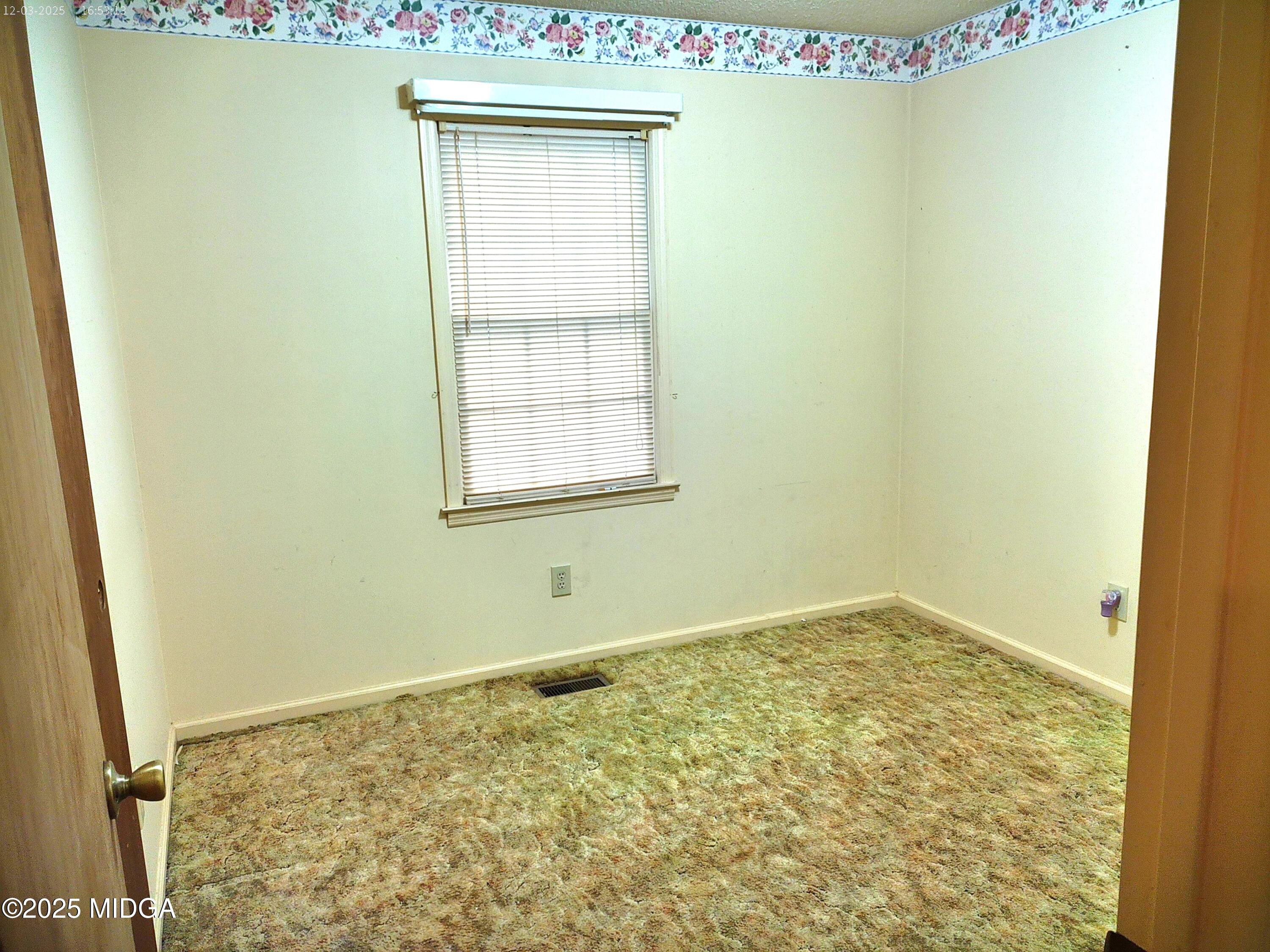 3850 Hitchcock Road Macon, GA 31217 - Photo 5 of 14 a view of an empty room with a window