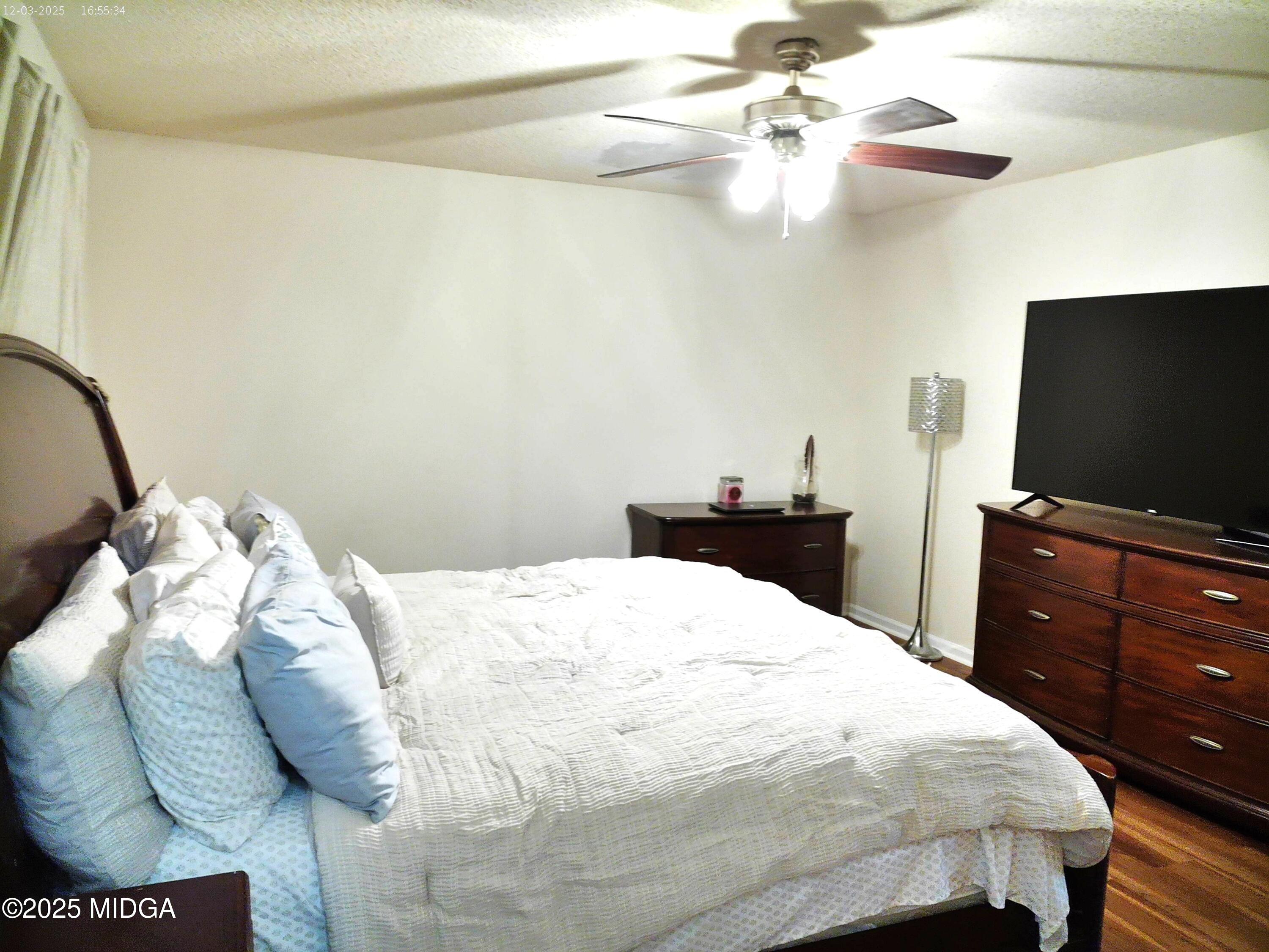 3850 Hitchcock Road Macon, GA 31217 - Photo 7 of 14 a bedroom with a bed and a flat screen tv