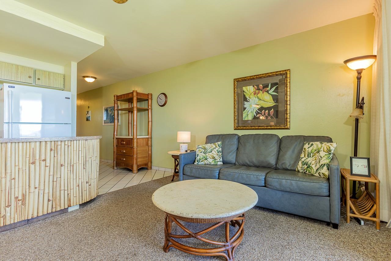 2936 South Kihei Road, Unit 613 Kihei, HI 96753 - Photo 11 of 46 a living room with furniture a couch and a table