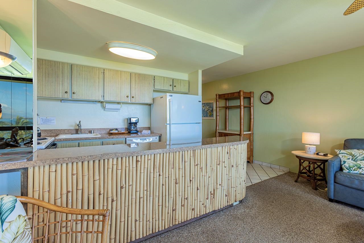 2936 South Kihei Road, Unit 613 Kihei, HI 96753 - Photo 13 of 46 a kitchen with a cabinets and window