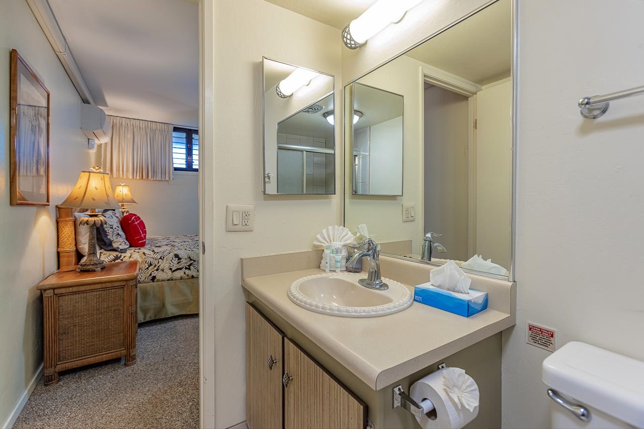 2936 South Kihei Road, Unit 613 Kihei, HI 96753 - Photo 22 of 46 a bathroom with a sink vanity and a mirror