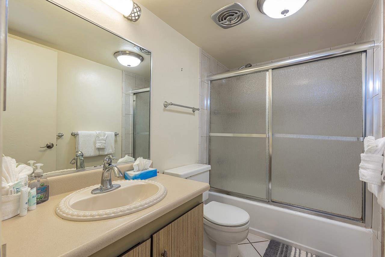 2936 South Kihei Road, Unit 613 Kihei, HI 96753 - Photo 24 of 46 a bathroom with a sink toilet and shower