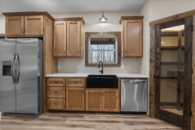 a stove top oven sitting inside of a kitchen