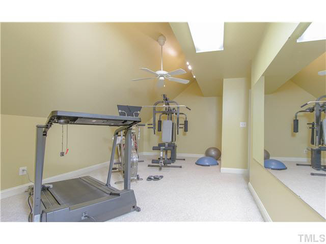 405 Mumm Lane Raleigh, NC 27615 - Photo 21 of 25 a room with gym equipment and view of living room