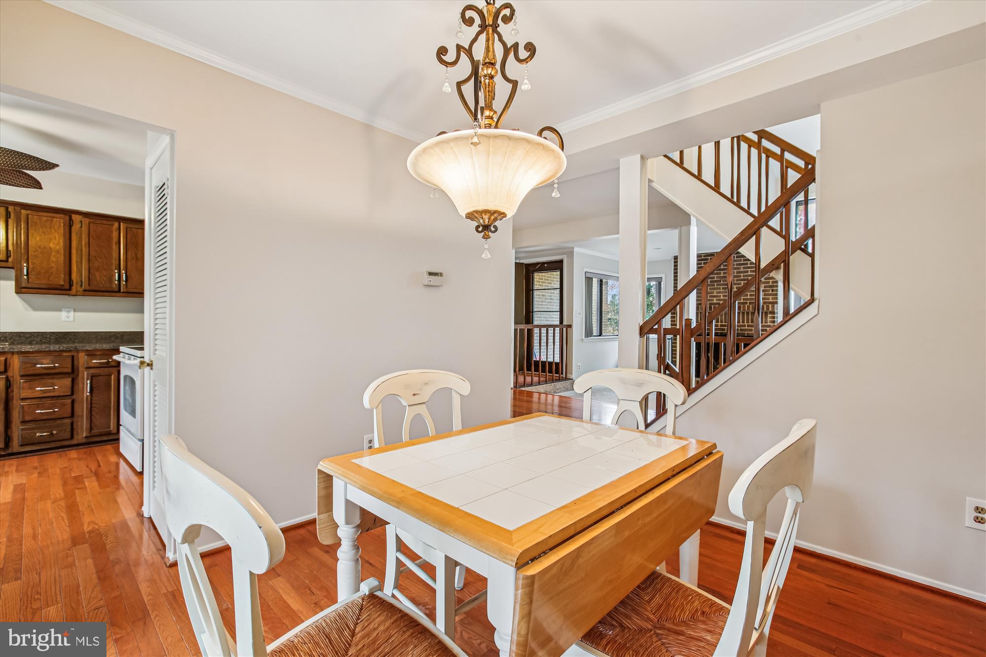 2025 Winged Foot Court Reston, VA 20191 - Photo 12 of 59 a view of a room with wooden floor chandelier entryway and wooden floor