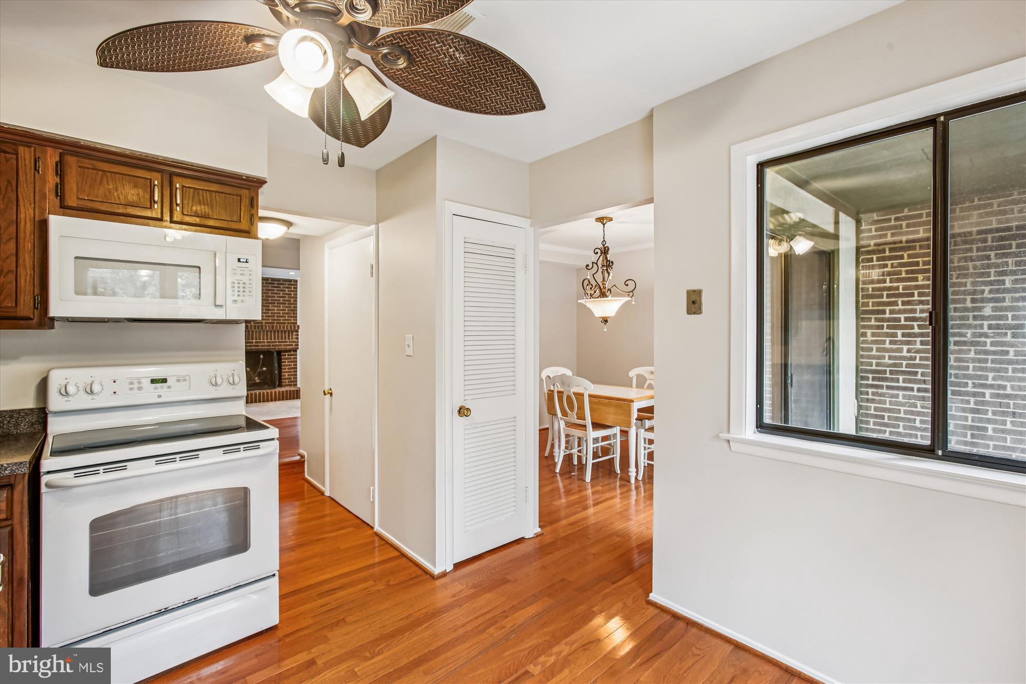 2025 Winged Foot Court Reston, VA 20191 - Photo 16 of 59 a kitchen with stainless steel appliances a stove a refrigerator and a microwave