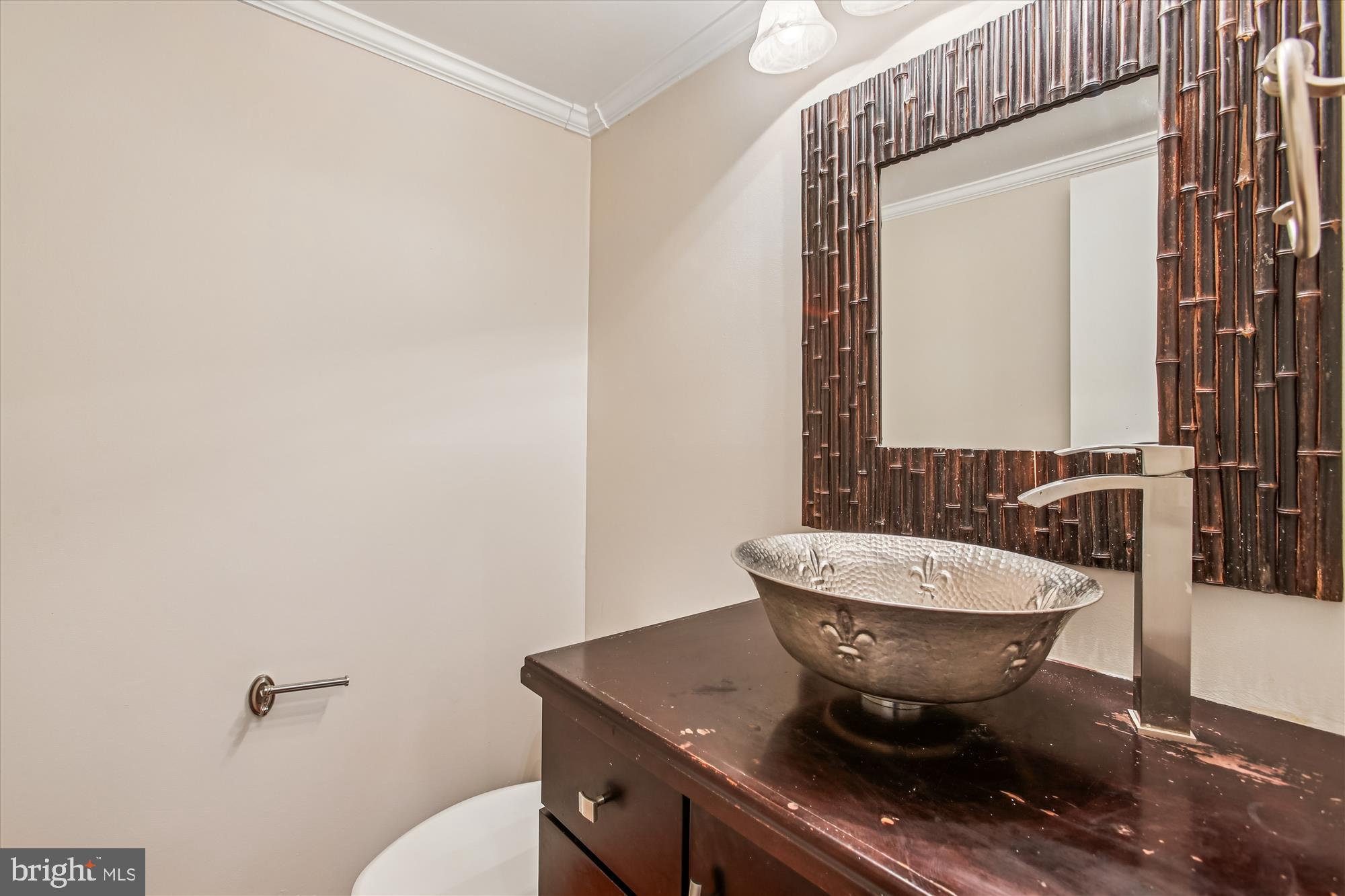 2025 Winged Foot Court Reston, VA 20191 - Photo 17 of 59 a bathroom with a sink and a mirror