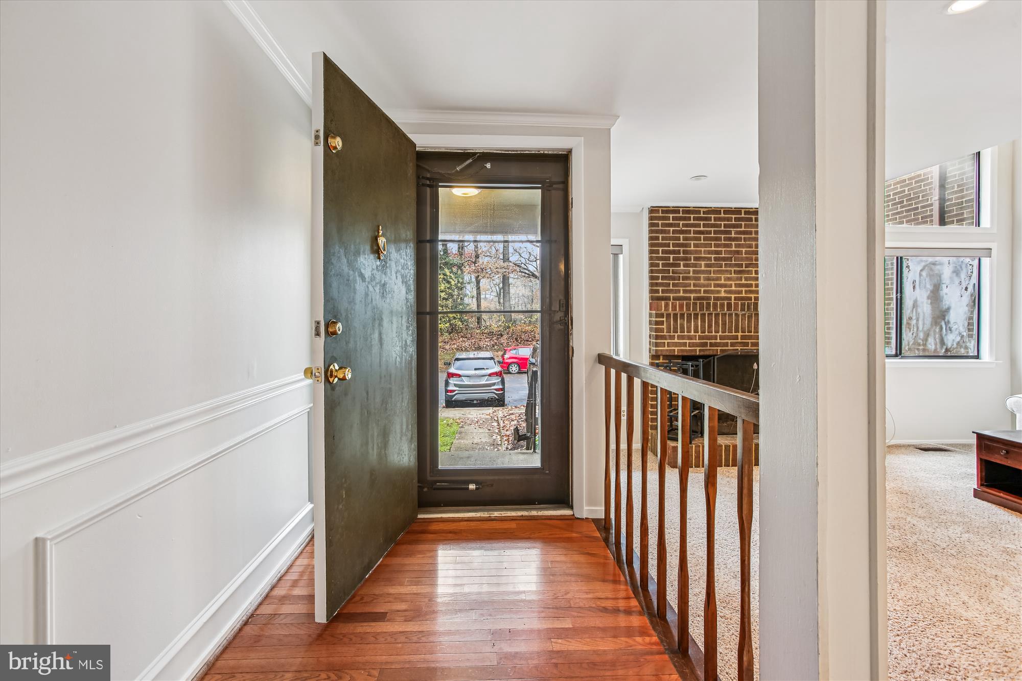 2025 Winged Foot Court Reston, VA 20191 - Photo 2 of 59 a view of a hallway with wooden floor and windows