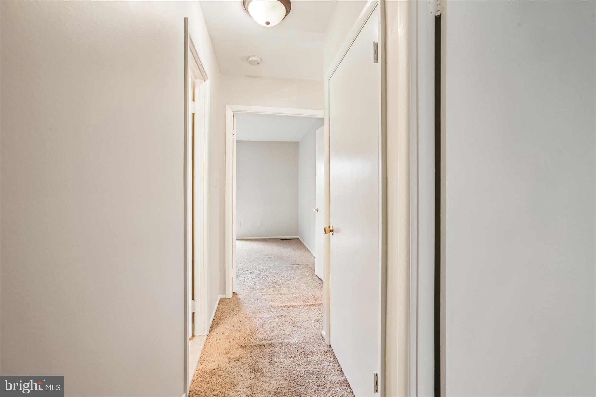 2025 Winged Foot Court Reston, VA 20191 - Photo 32 of 59 a view of a bathroom from a corridor