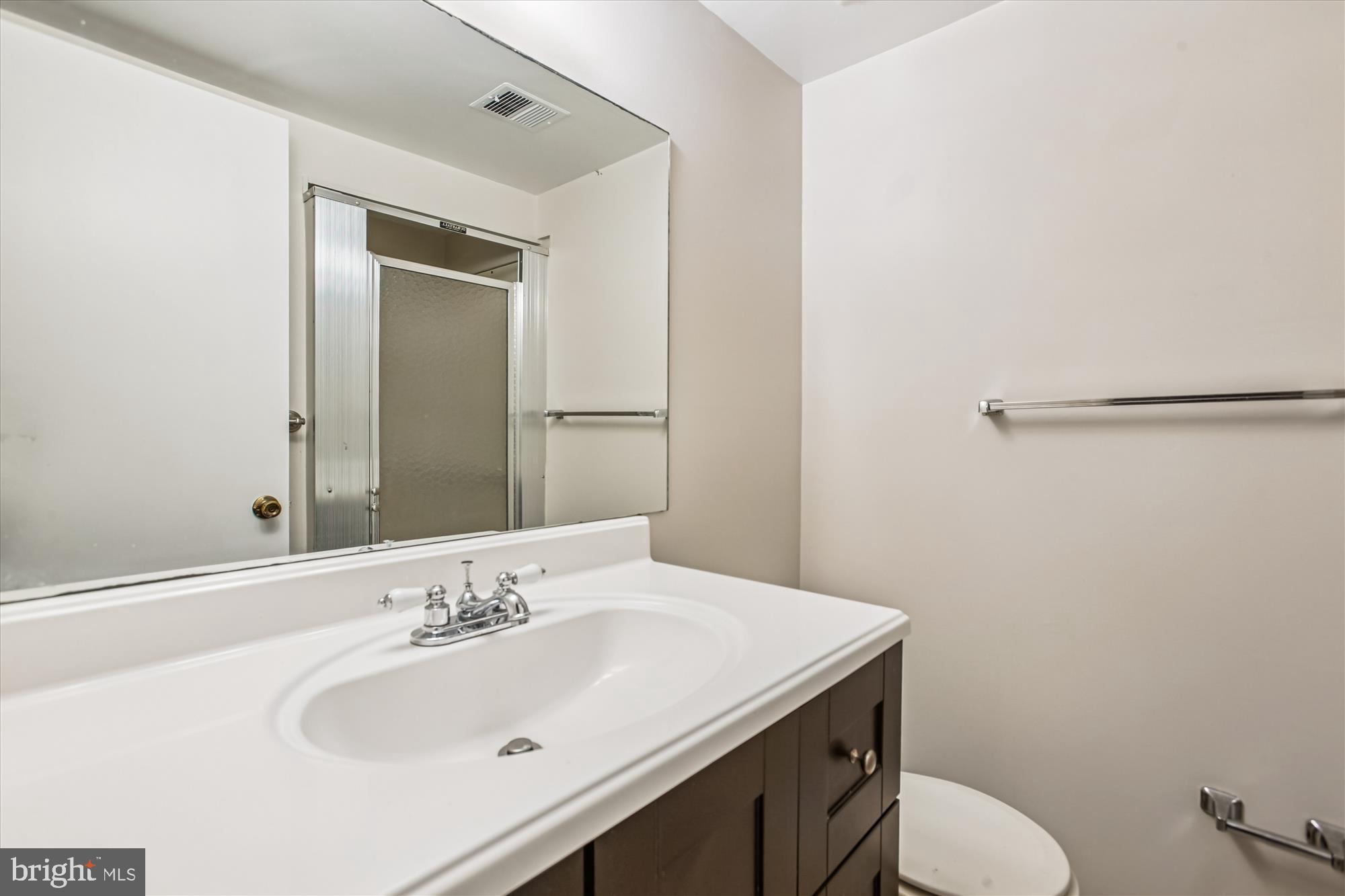 2025 Winged Foot Court Reston, VA 20191 - Photo 37 of 59 a bathroom with a sink and a toilet