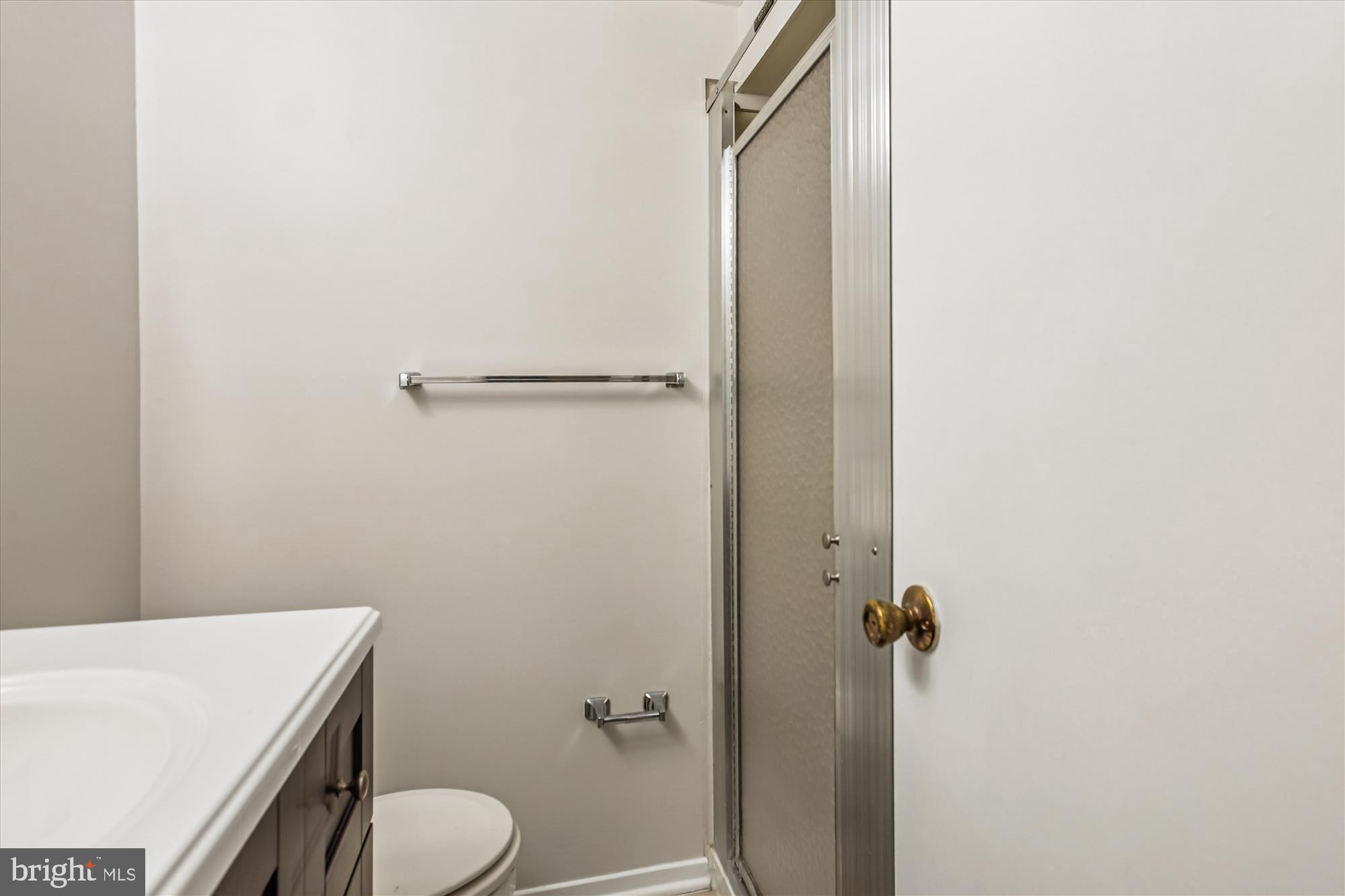 2025 Winged Foot Court Reston, VA 20191 - Photo 38 of 59 a bathroom with a granite countertop toilet and a sink