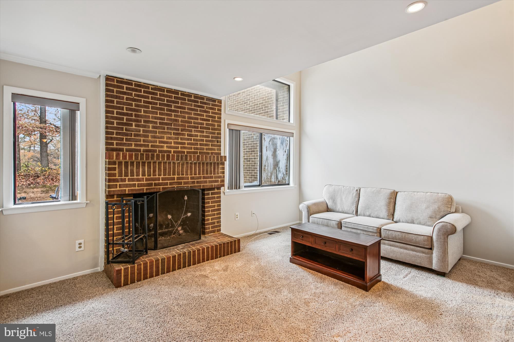 2025 Winged Foot Court Reston, VA 20191 - Photo 6 of 59 a living room with furniture and a fireplace
