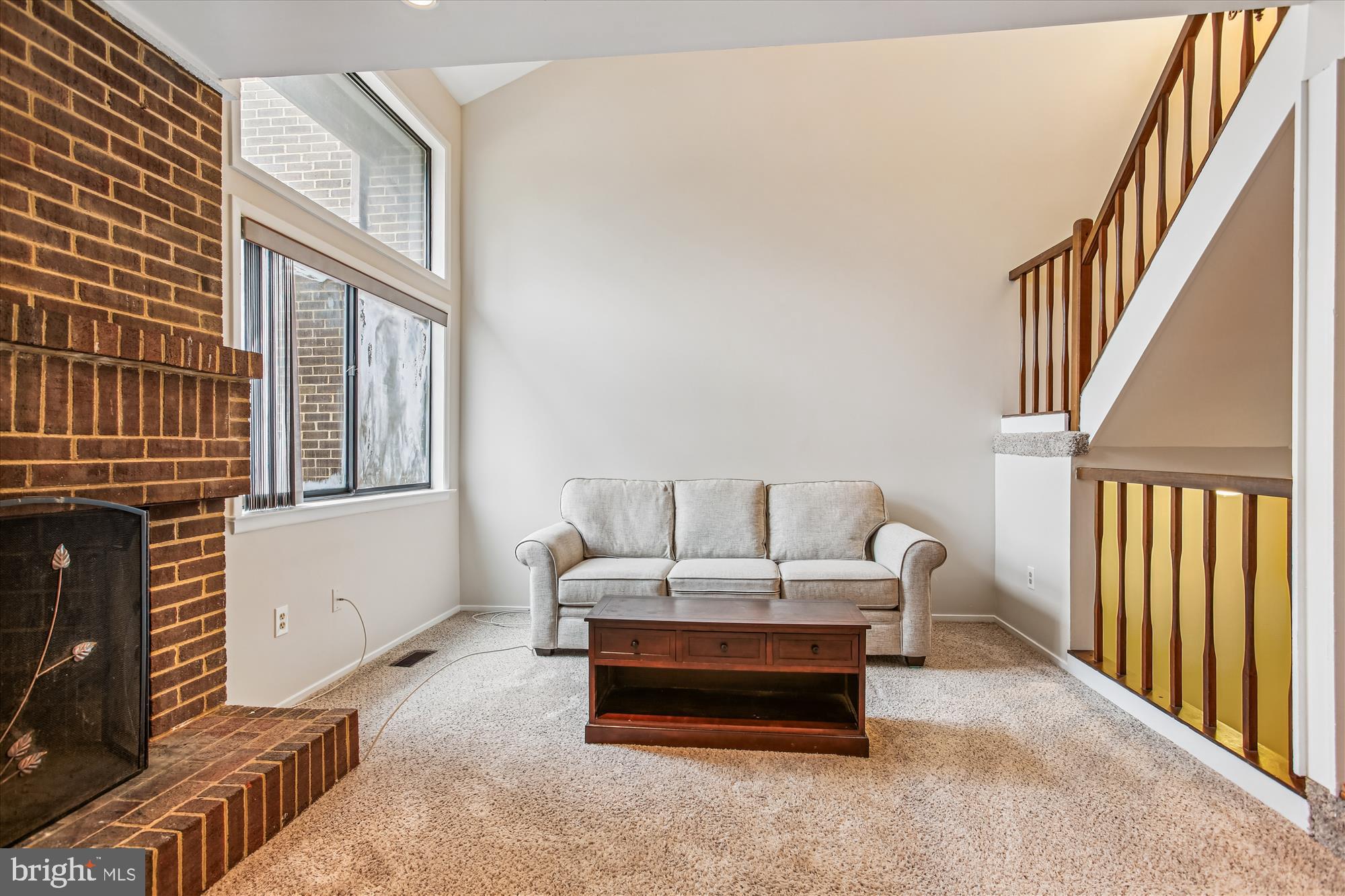 2025 Winged Foot Court Reston, VA 20191 - Photo 7 of 59 a living room with furniture and a window