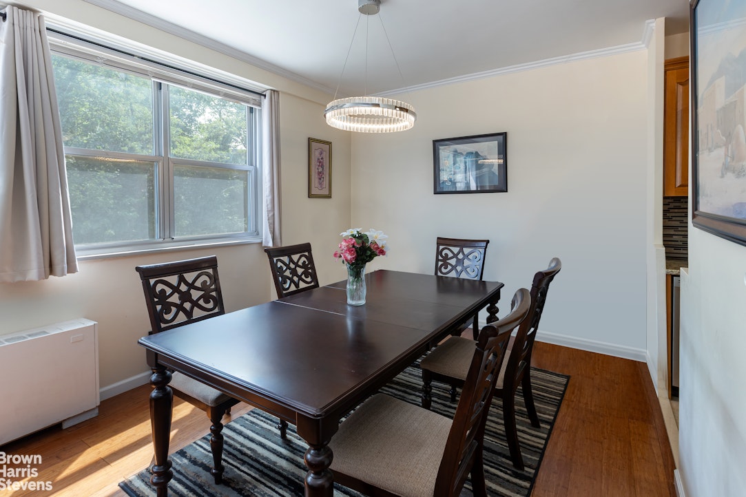 555 Kappock Street, Unit 2E Bronx, NY 10463 - Photo 7 of 39 a view of a dining room with furniture and wooden floor
