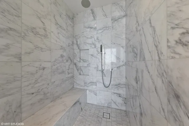 a bathroom with a double vanity sink and a window