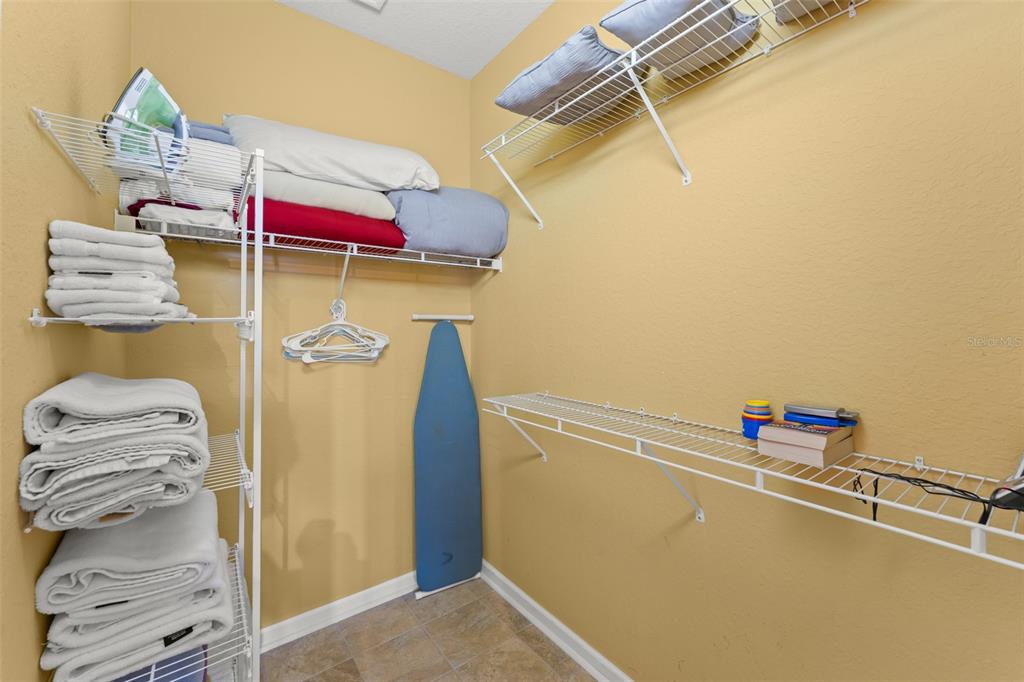 7675 Comrow Street, Unit 405 Kissimmee, FL 34747 - Photo 18 of 40 a view of walk in closet with clothes and shoes