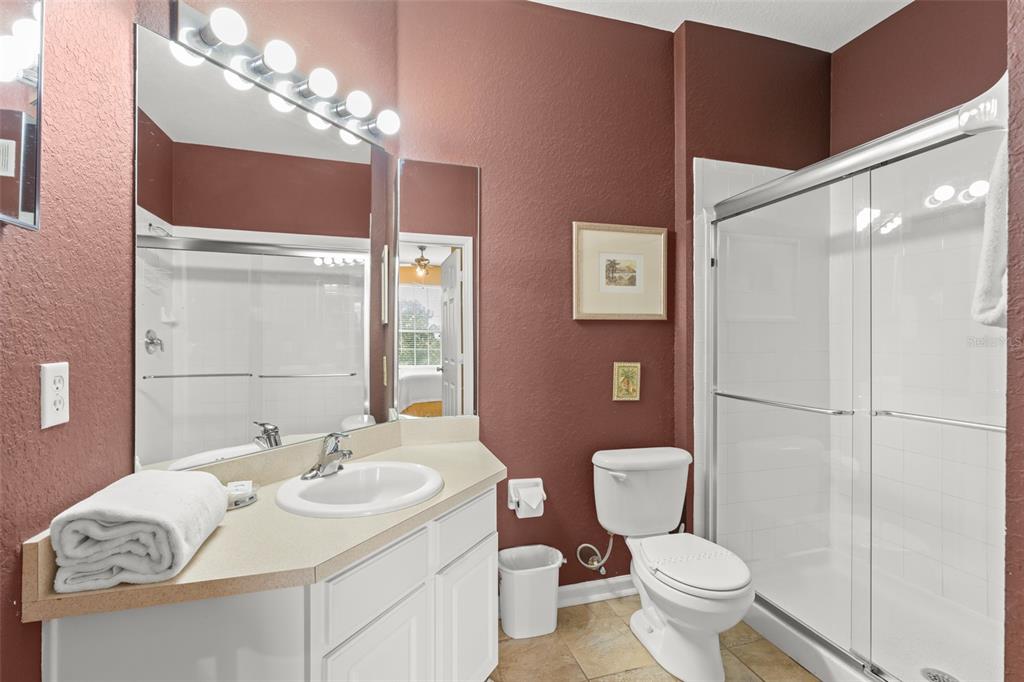 7675 Comrow Street, Unit 405 Kissimmee, FL 34747 - Photo 19 of 40 a bathroom with a sink toilet vanity and shower