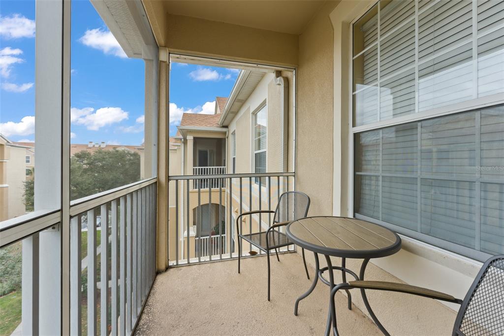 7675 Comrow Street, Unit 405 Kissimmee, FL 34747 - Photo 28 of 40 a view of a balcony with chairs