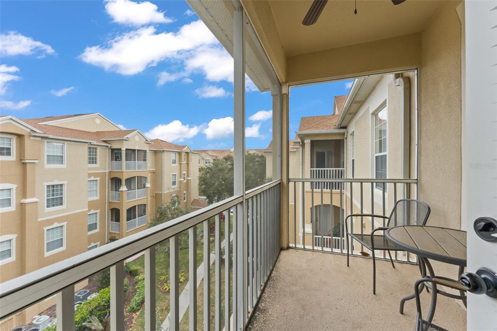 7675 Comrow Street, Unit 405 Kissimmee, FL 34747 - Photo 29 of 40 a view of a large building from a balcony