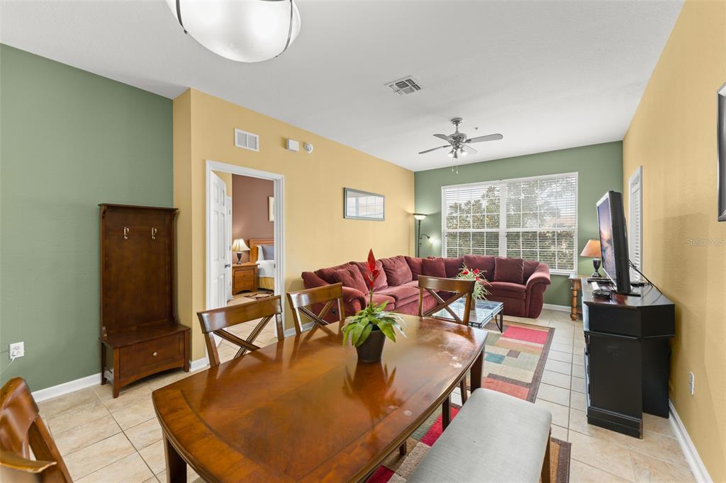 7675 Comrow Street, Unit 405 Kissimmee, FL 34747 - Photo 10 of 40 a living room with furniture and a large window