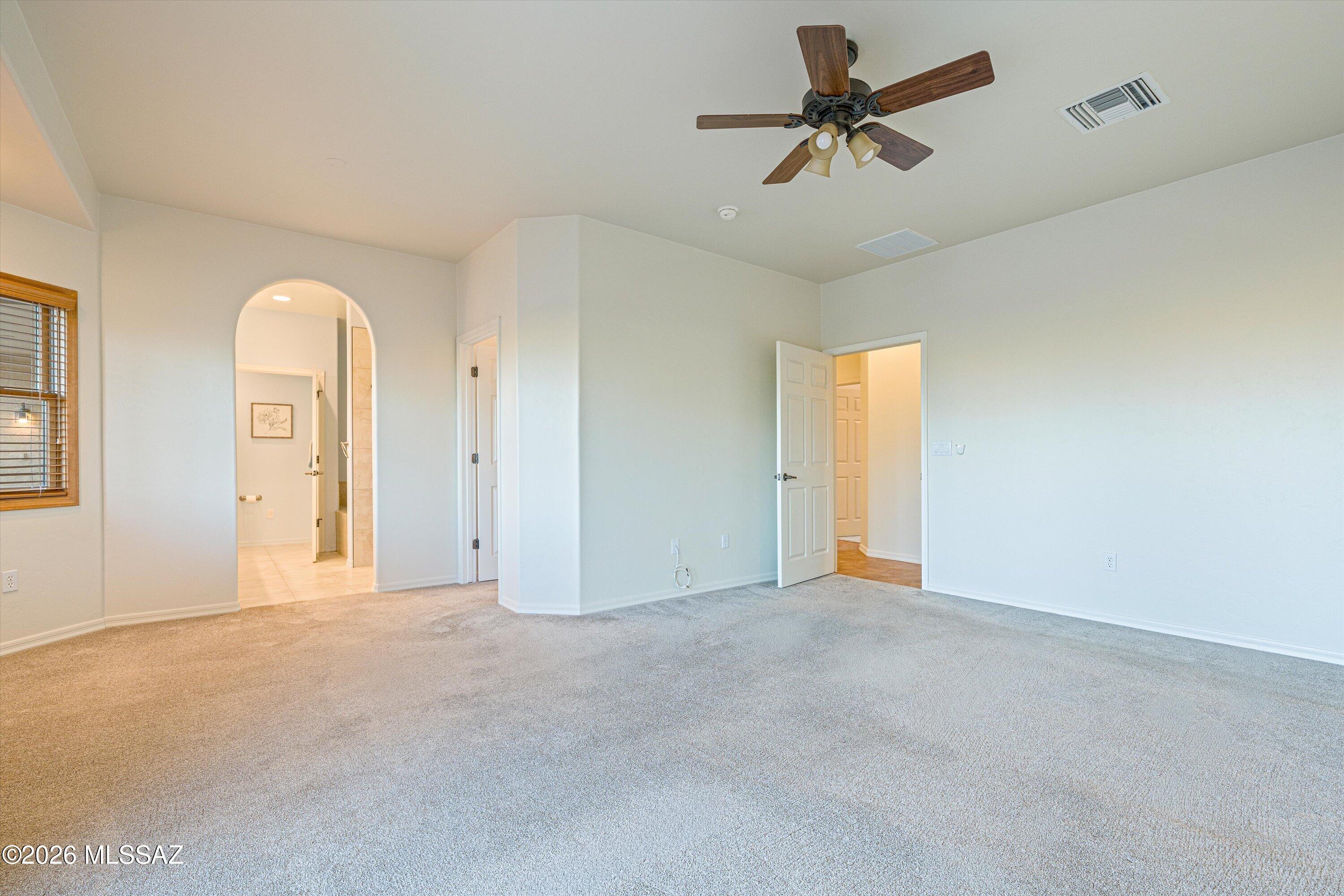240 Sharon Road Vail, AZ 85641 - Photo 23 of 43 Large primary suite with direct access to back patio for sunsets, sipping & swimming