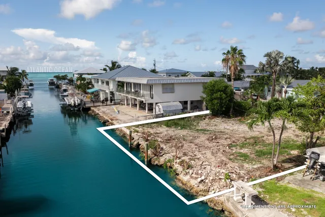an aerial view of house with yard