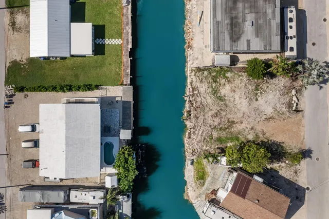 aerial view of a house with a yard