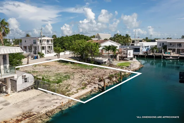 a view of a swimming pool with an outdoor seating