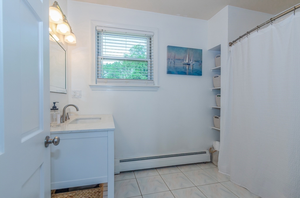 1-3 Doctor Hickey Lane Rochester, MA 02770 - Photo 16 of 38 a bathroom with a sink and a mirror