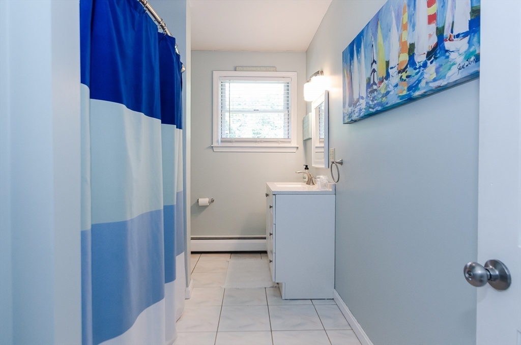 1-3 Doctor Hickey Lane Rochester, MA 02770 - Photo 18 of 38 a bathroom with a sink and a mirror
