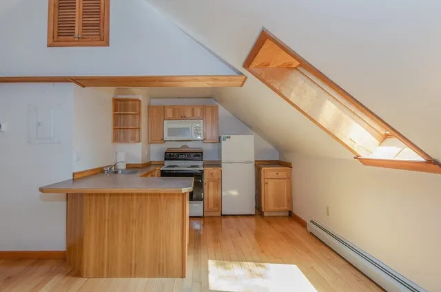 a kitchen that has a sink and a stove