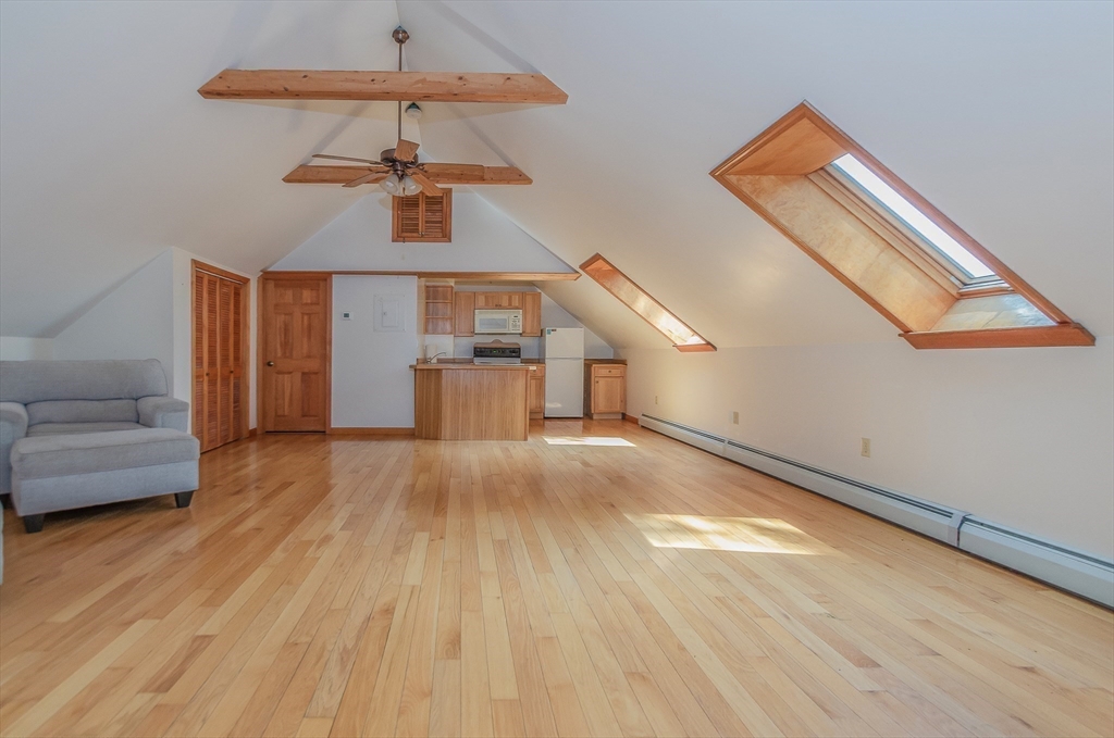 1-3 Doctor Hickey Lane Rochester, MA 02770 - Photo 22 of 38 a view of empty room with wooden floor and windows