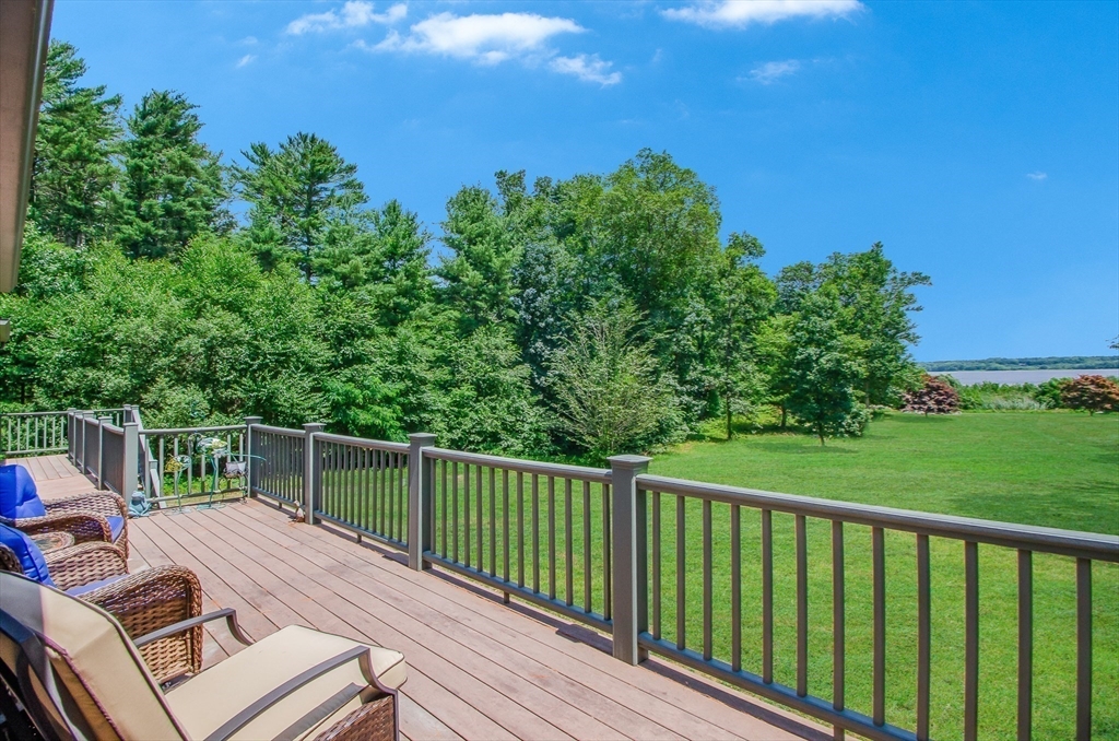 1-3 Doctor Hickey Lane Rochester, MA 02770 - Photo 33 of 38 a view of a balcony with wooden floor and fence