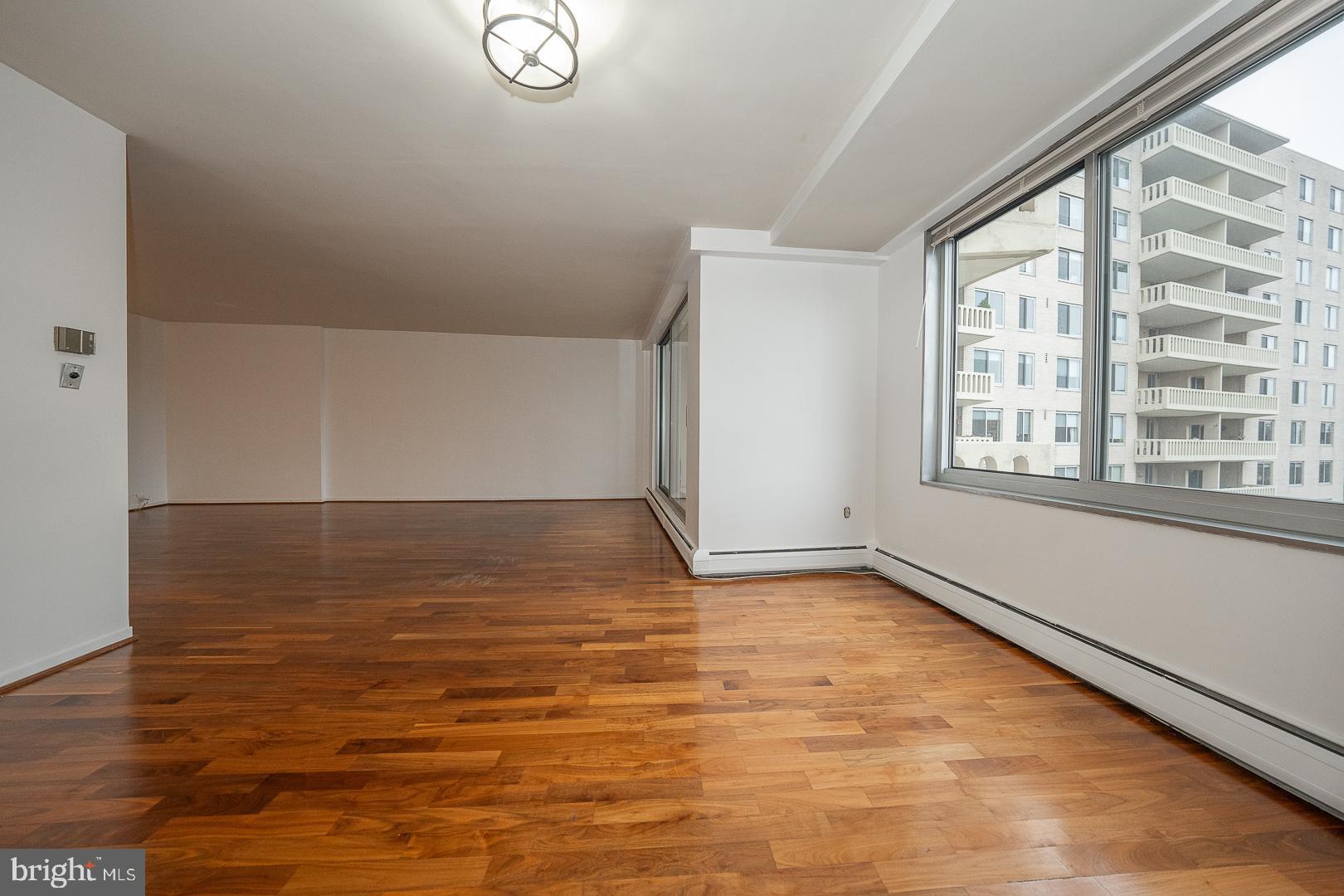191 Presidential Boulevard, Unit R402 Bala Cynwyd, PA 19004 - Photo 11 of 27 a view of an empty room with wooden floor and a window