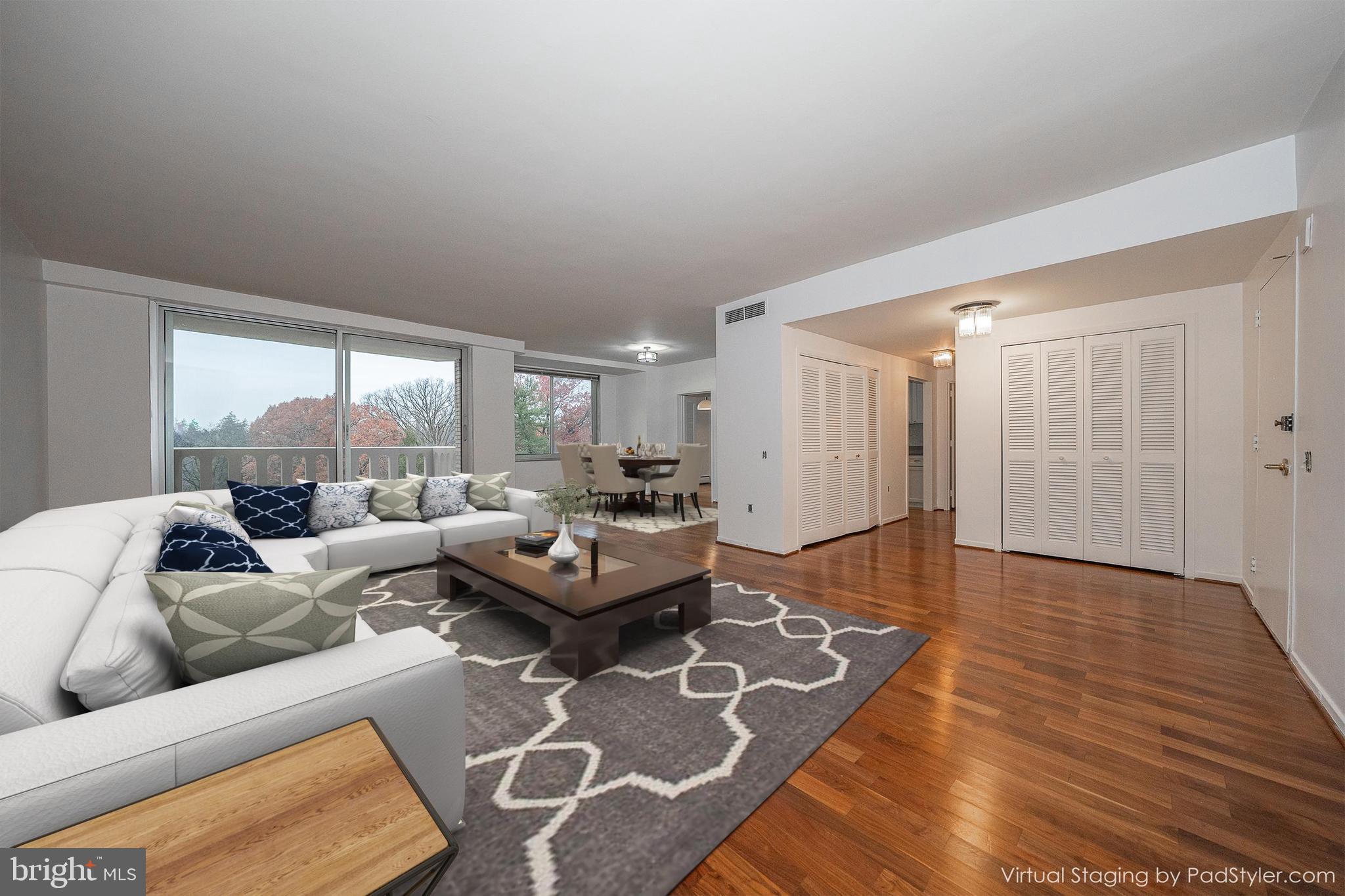 191 Presidential Boulevard, Unit R402 Bala Cynwyd, PA 19004 - Photo 13 of 27 a living room with furniture and a large window