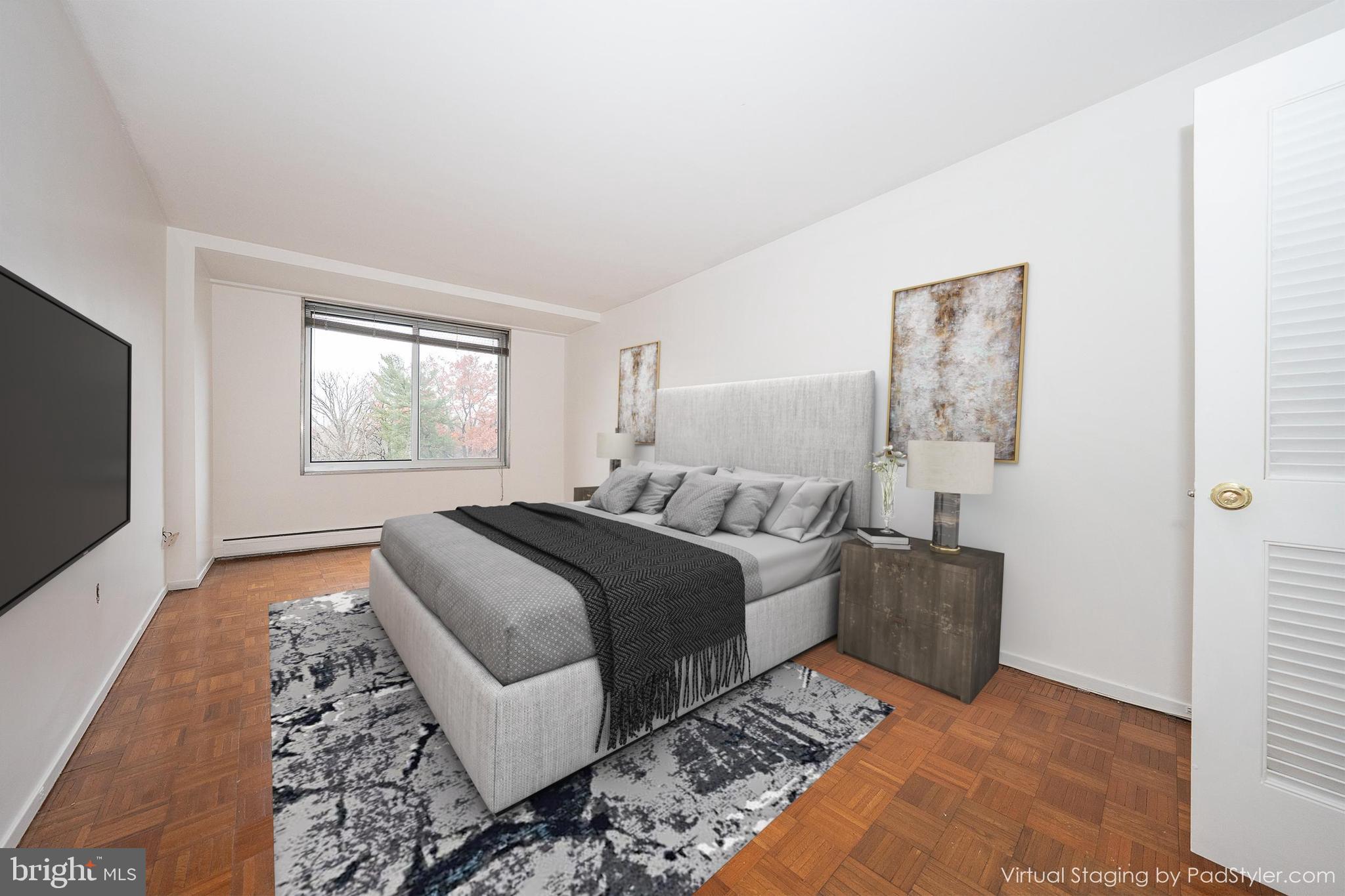 191 Presidential Boulevard, Unit R402 Bala Cynwyd, PA 19004 - Photo 16 of 27 a bedroom with a bed and a television