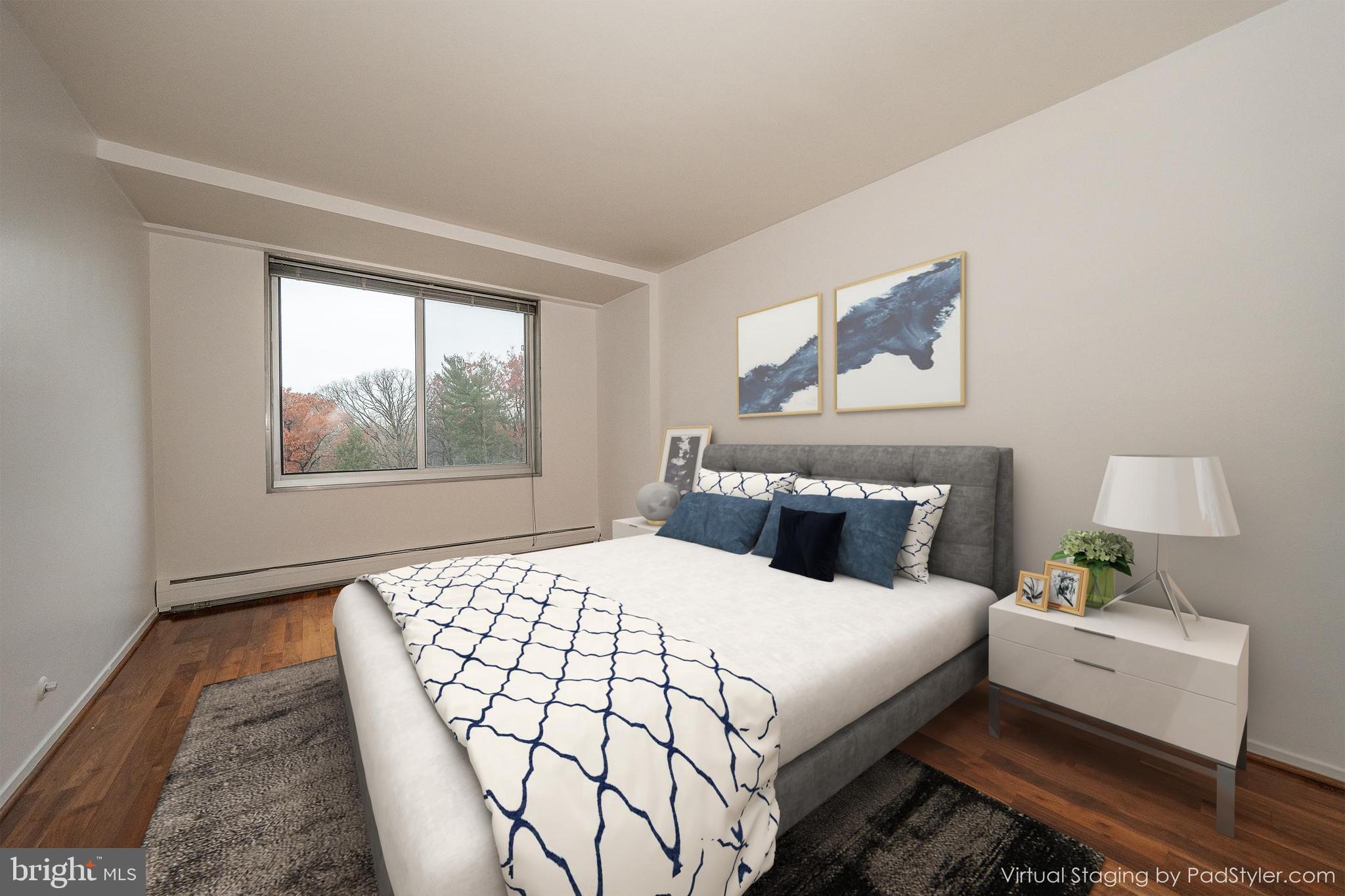 191 Presidential Boulevard, Unit R402 Bala Cynwyd, PA 19004 - Photo 17 of 27 a bedroom with a bed and a window with outer view