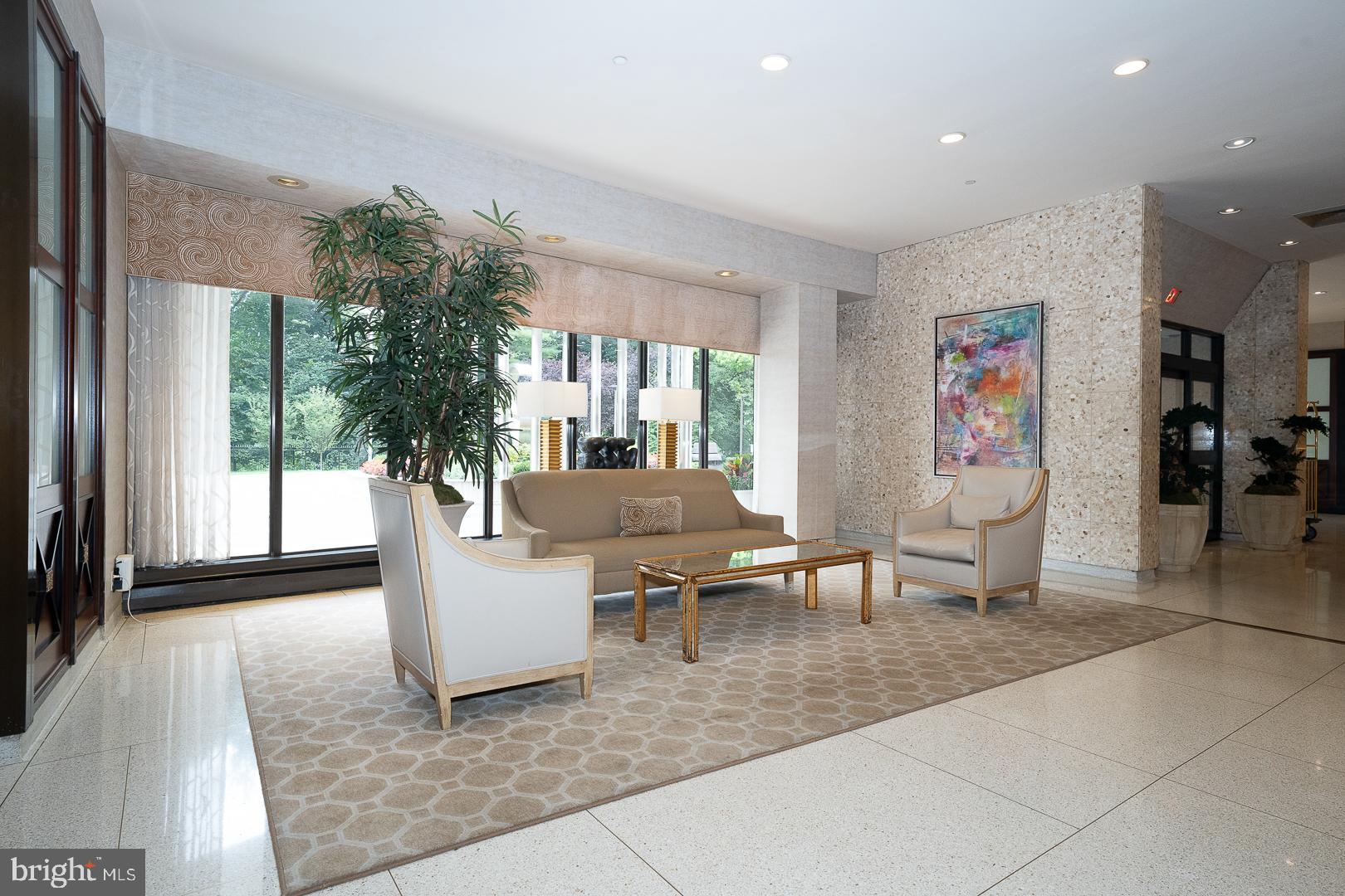 191 Presidential Boulevard, Unit R402 Bala Cynwyd, PA 19004 - Photo 3 of 27 a living room with furniture and a large window