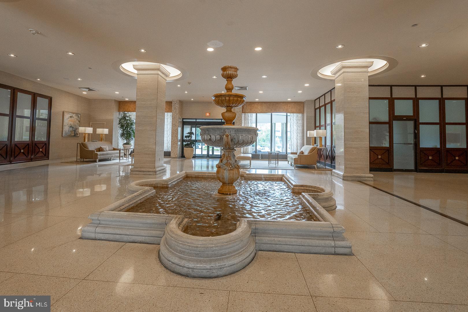 191 Presidential Boulevard, Unit R402 Bala Cynwyd, PA 19004 - Photo 4 of 27 a dining hall with a dining table and chairs