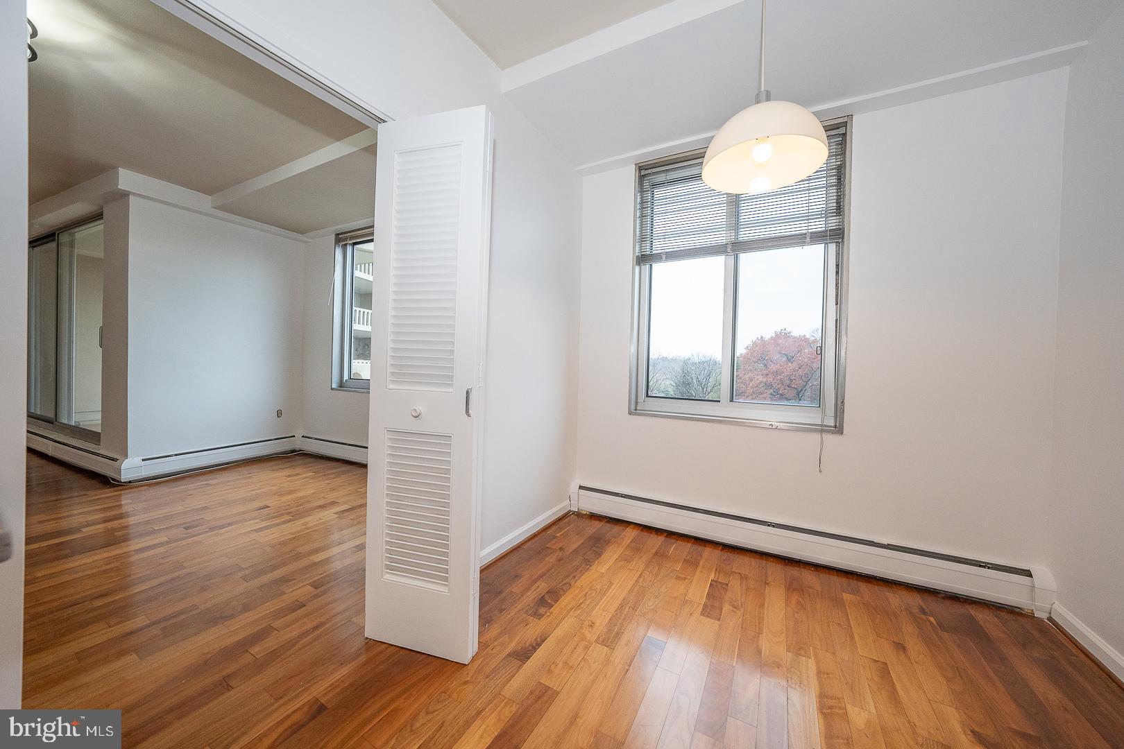 191 Presidential Boulevard, Unit R402 Bala Cynwyd, PA 19004 - Photo 10 of 27 a view of empty room with wooden floor and fan