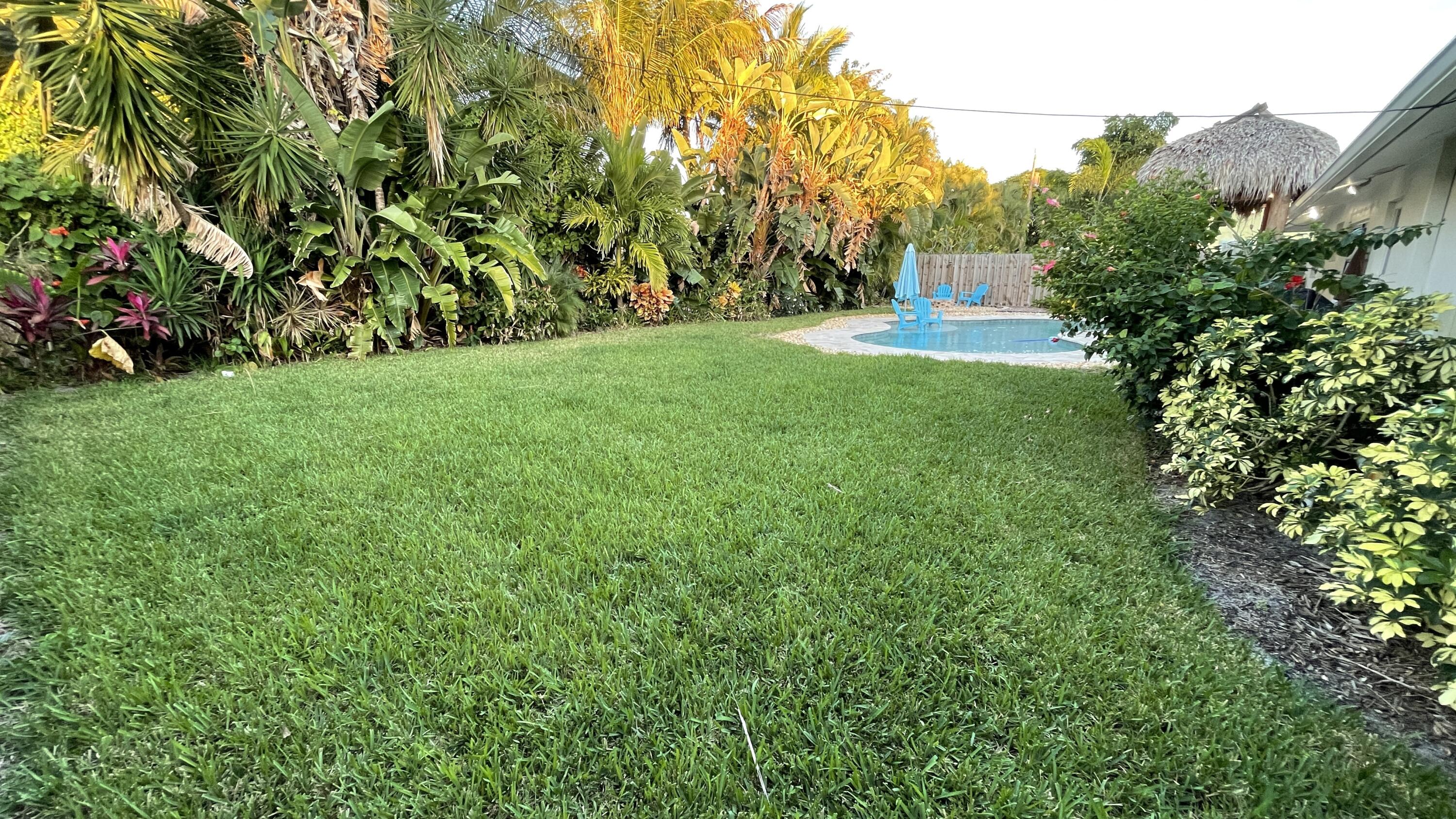 103 East Riverside Drive Jupiter, FL 33469 - Photo 30 of 66 Large Green space in backyard