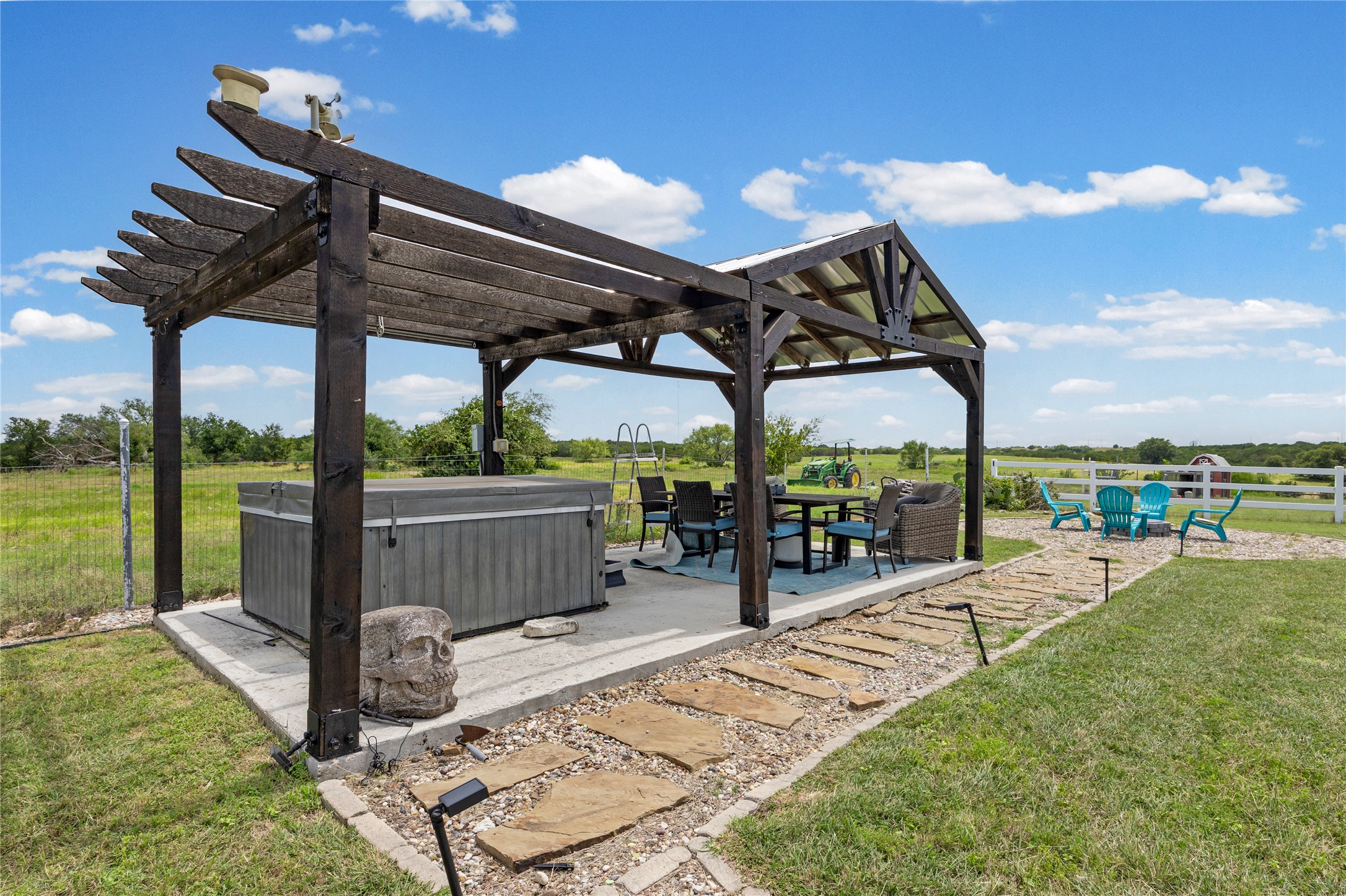 1283 Rattlesnake Trail Burnet, TX 78611 - Photo 34 of 39 a view of a patio with a table chairs and a backyard