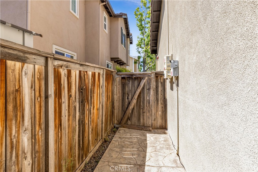 9 Fieldhouse Ladera Ranch, CA 92694 - Photo 26 of 33 Pathway behind home wraps around past garage to side fence