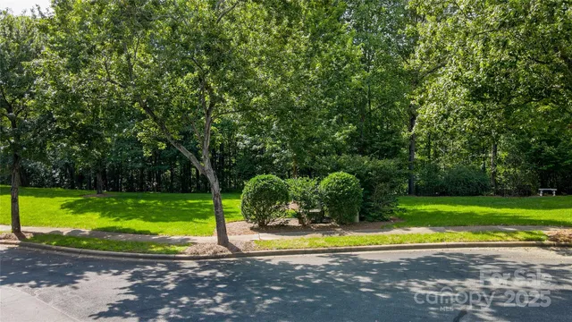 an aerial view of residential house with outdoor space and swimming pool