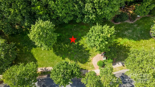 an aerial view of a house with yard outdoor seating and lake view